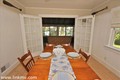 Dining room opening to the sunroom