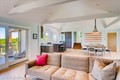 Sliding glass doors lead out to