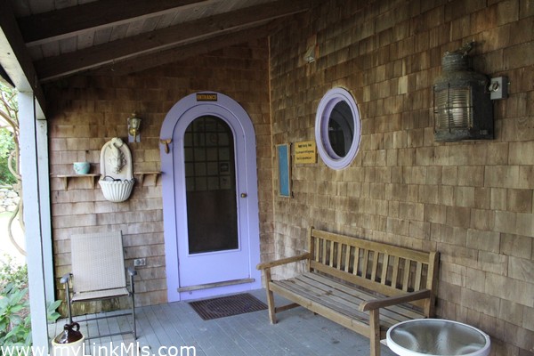 Main House Front Porch Entrance to Kitchen/Laundry area. Custom made Round doors