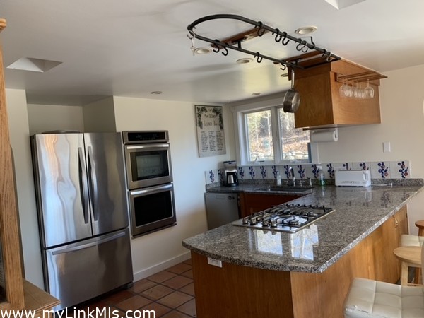 Kitchen, with wrought iron hanging pot rack