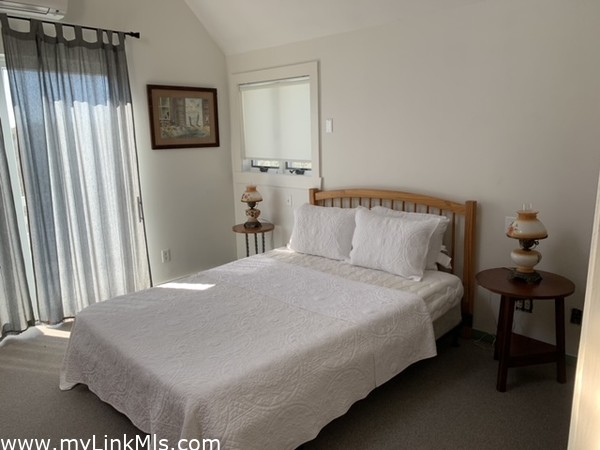 2nd floor Master Bedroom with Queen Bed and Large private deck with alfresco outdoor shower and spiral staircase to first floor deck.