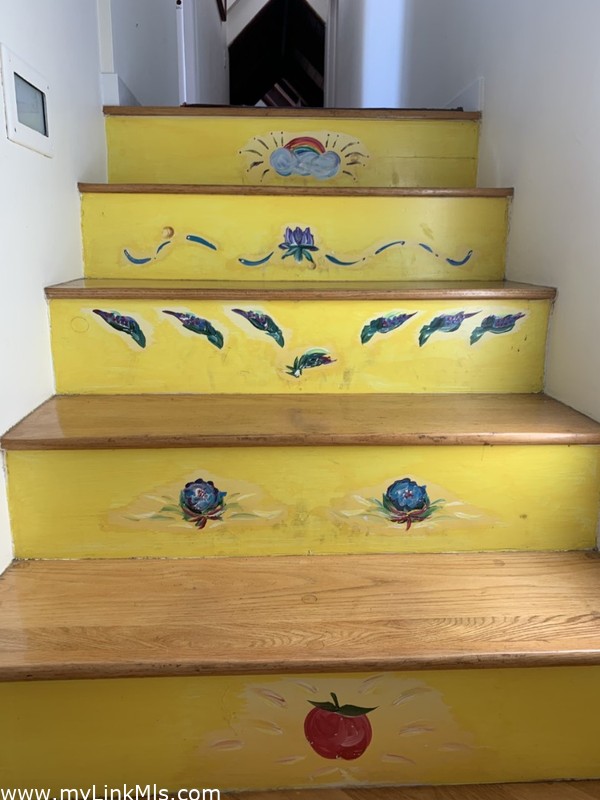 Custom painted by local artist, wood silo staircase
