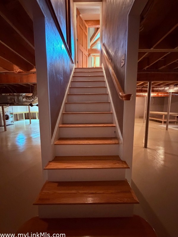 Stairs to the first floor from basement