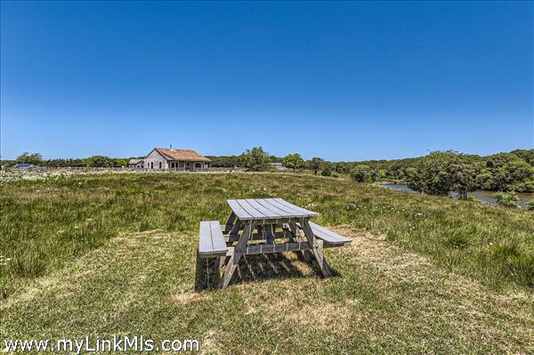 picnic bench half way between the homes