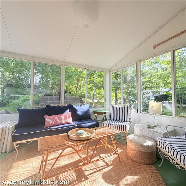 Sun porch enclosed perfect for reading and relaxing.