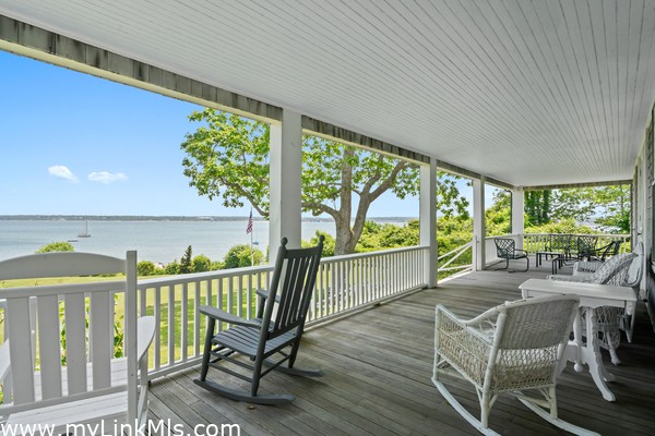 The best seat in town! The expansive, wrap-around front porch
