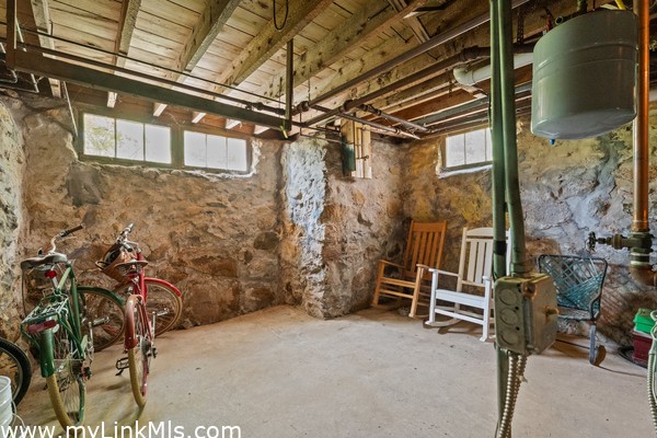 Dry basement with high ceilings and interesting stone foundation