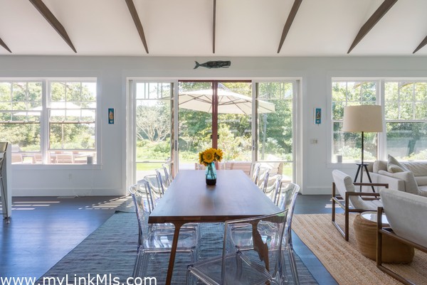 dining facing south overlooking the water and the deck