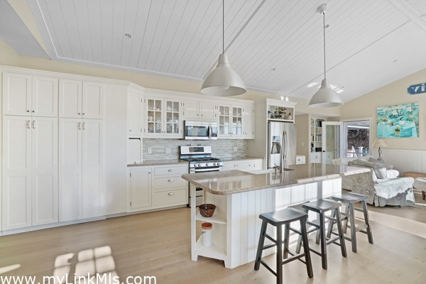Open floor plan with center kitchen