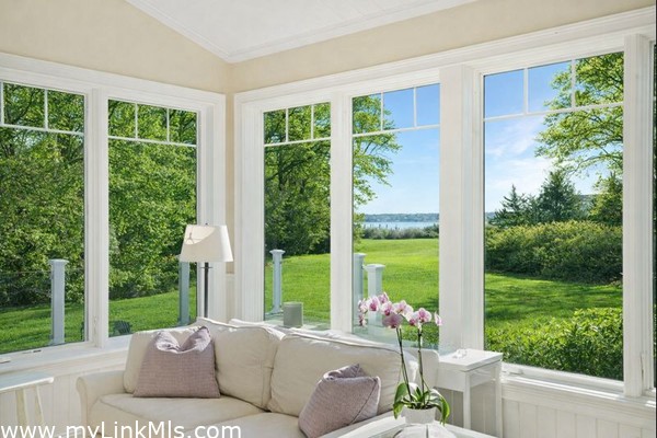 Views from living space out to the Harbor. Photo virtually altered to show seasonality