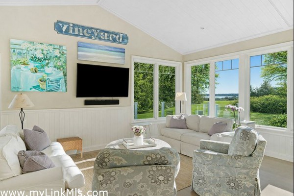 Views from living space out to the Harbor. Photo virtually altered to show seasonality