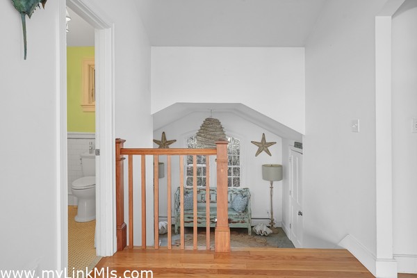 Powder room and stairs to front entryway