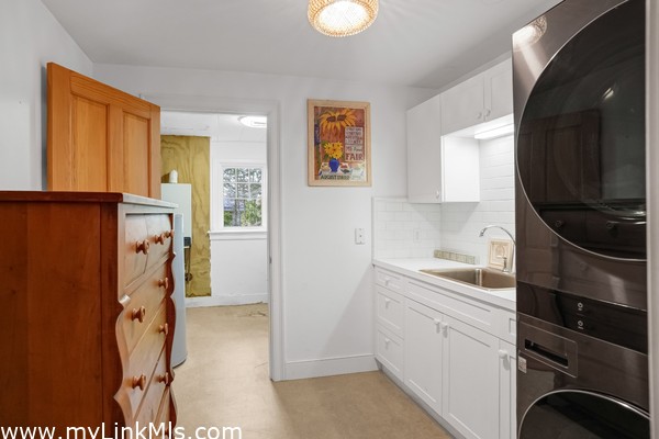 Laundry room leads to storage room
