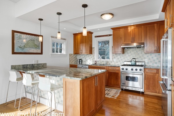 Open kitchen with granite countertops and center Island