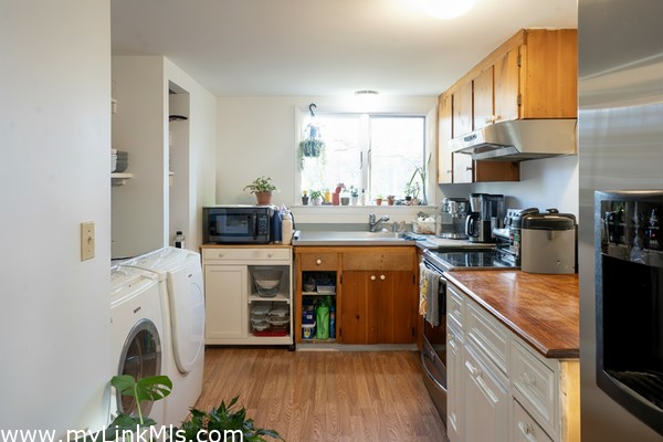 Kitchen with side by side Washer & Dryer
