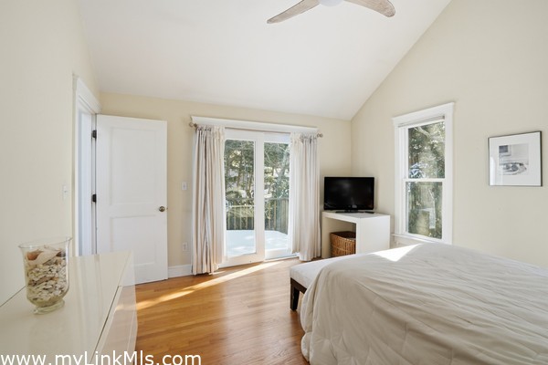 Primary bedroom with a forth slider to inviting deck.
