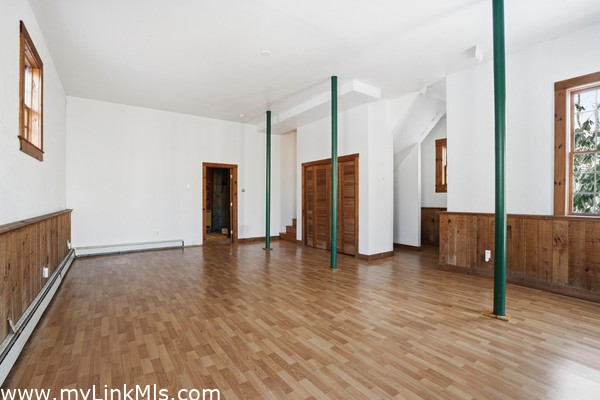 Large basement with eighteen foot ceiling and full bath.