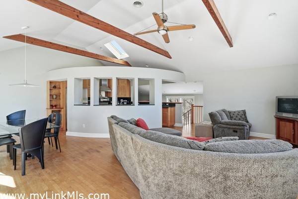 Livingroom to kitchen high vaulted ceilings