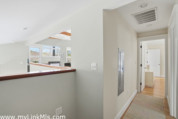 Primary suite with walk-in closet, sitting area, full bath with private access to exterior deck.