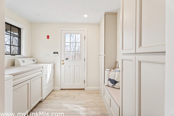 Side entrance mud room with Speed Queen washer & dryer, custom cabinetry renovated in 2025