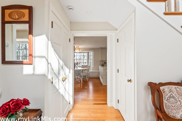 Light filled entry way leads to the kitchen, stairs to the second floor