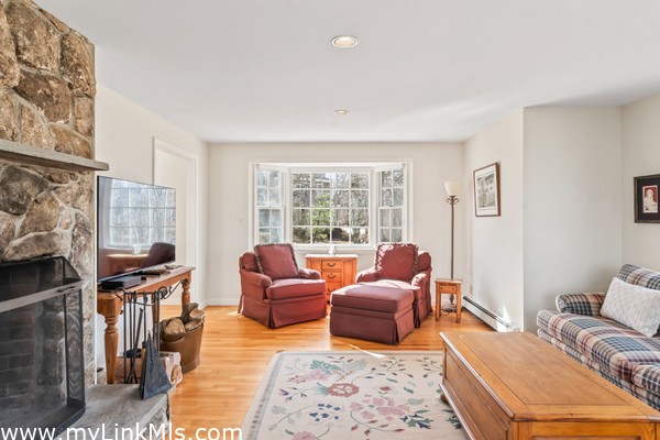 Living Room features oak floors and beautiful bay windows