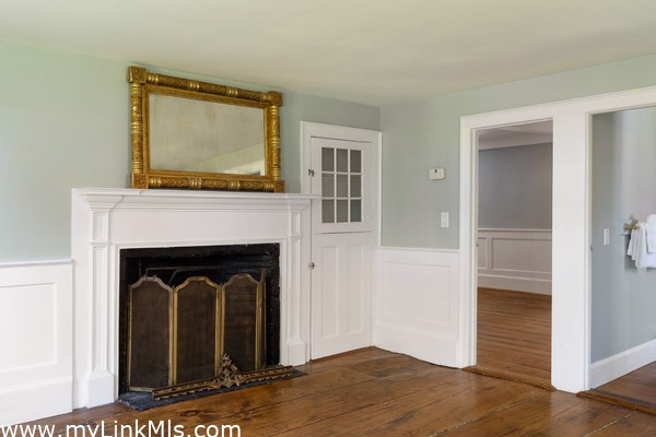 Family room with historic King's board flooring and second fireplace