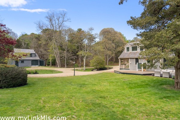 View of the main house and carriage house beyond