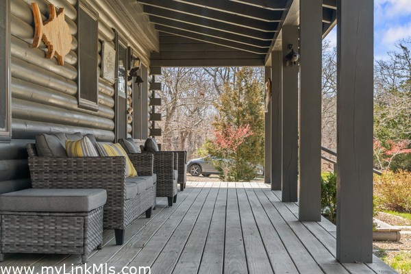 Guest house front porch furnished for relaxation