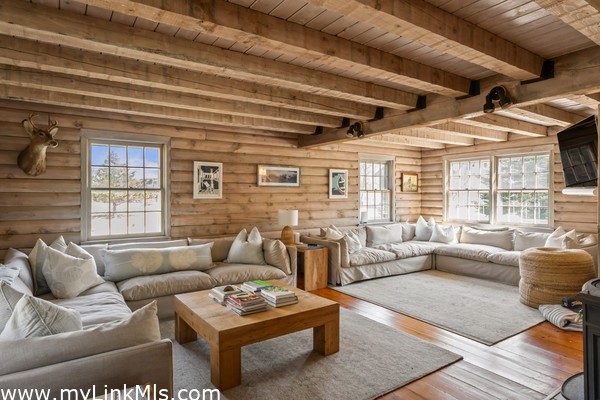 Living room with custom decor, bespoke wood tables and textiles, new furnishings from Vineyard Decorators.