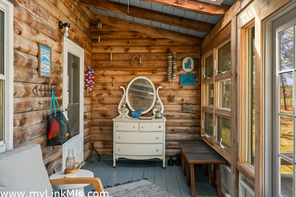 Main House has so many charming places to gather - enclosed three-season porch