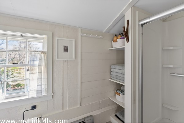 2nd flr Full Bath with shower and built-in linen closet
