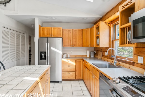 Guest house features kitchen propane stove, stainless steel appliances and beautiful natural light