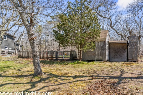 Picket fence around a kitchen garden area waiting for your vision - garden shed and additional storage