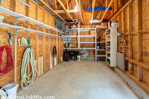 Garage with custom shelving and lots of storage space