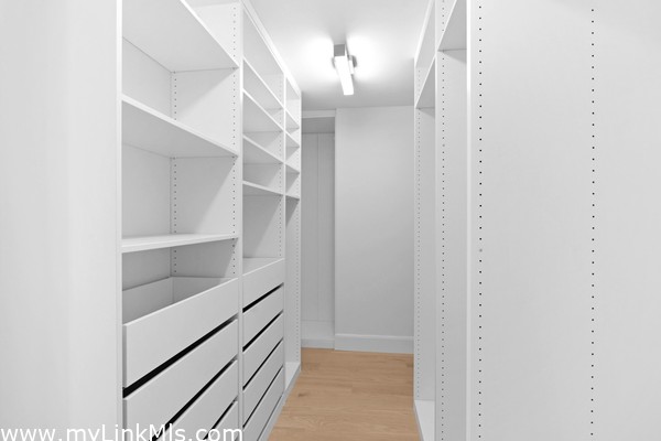 Walk-in closet 1st floor bedroom.