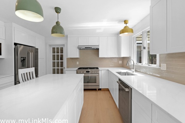 Gourmet kitchen with center island, french door to dining room.