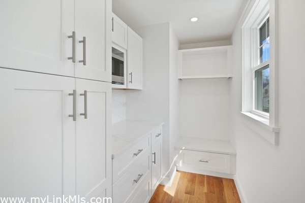 Chef's pantry doubles as dry bar and/or coffee station with extra storage.