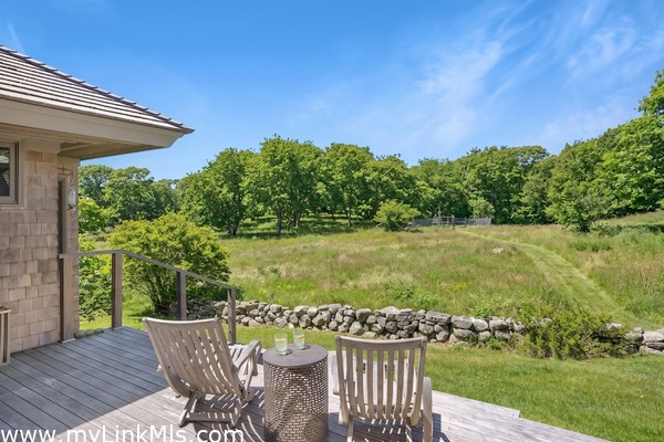 Enjoy your morning coffee or evening cocktails from the back deck looking out over the meadow.