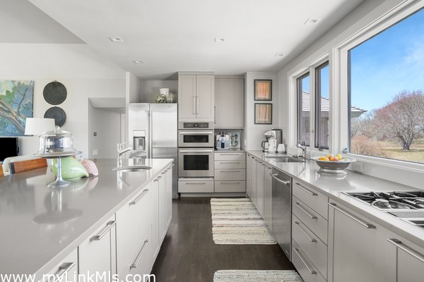 The renovated kitchen is modern and bright.