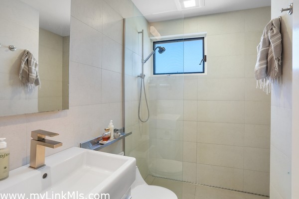 Both renovated bathrooms have tiled walk-in showers.