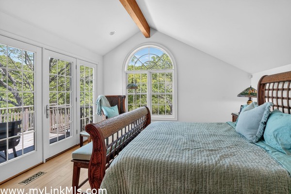 Sun-drenched primary suite with a dedicated office/sitting area