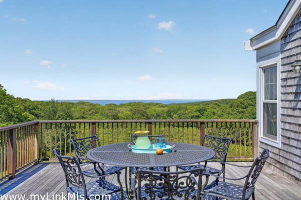 Expansive deck overlooking the rolling hills and Vineyard Sound