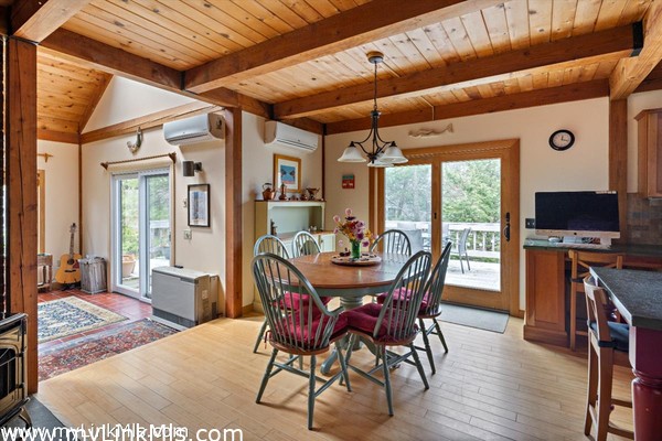 The dining room boasts a fabulous enamel pellet stove
