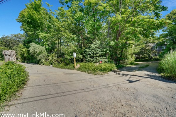 Driveway on right and beginning of separate lot