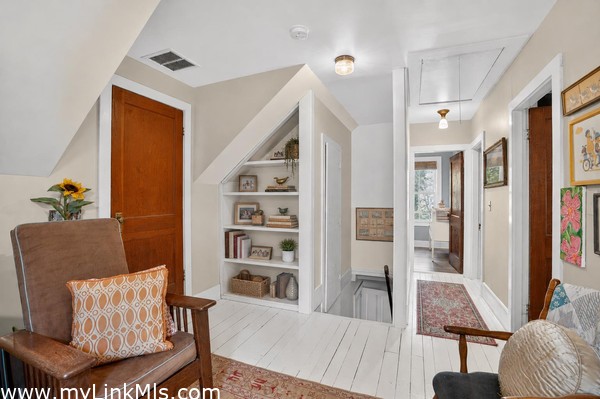 Second floor flex space and hallway to bedrooms and shared bath