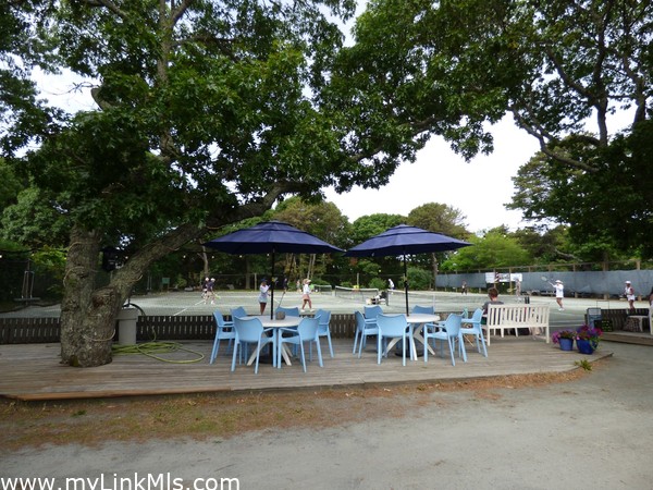 Tennis court. Sitting area to watch the games.