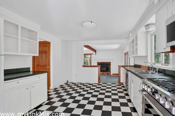 Open kitchen that leads to sunken living/dining area