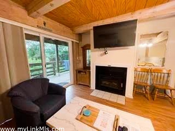 open living concept with fireplace and tv