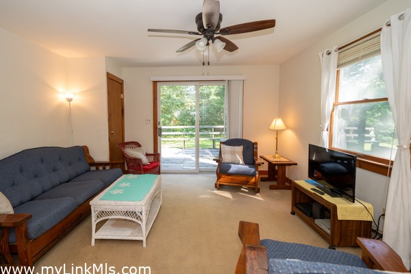 Living room with sliding doors to the back deck